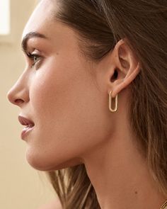 The gold plated Parker Huggies offer a sleek and retro-inspired style. Perfect in first piercings, these elongated huggies offer a high-shine finish and add a touch of glamour to any look. With a high-shine finish, these elongated, retro huggies are the summer earrings you will put on and never want to take off. Gorjana Earrings, Paperclip Earrings, Turquoise Birthstone, Spring Styling, Earrings Gold Hoops, Jewelry Layering, Chic Streetwear, Layering Jewelry, Strawberry Charm