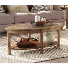 a living room with a couch, coffee table and pillows on the carpeted floor