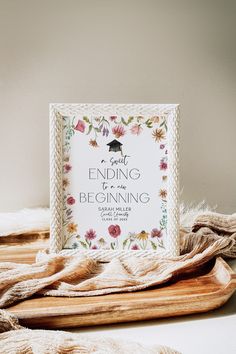 a white framed sign that reads, i got ending to be beginning with flowers on it