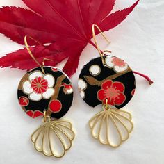 "About the earrings: These art deco earrings are made with a luscious, black, red and white chiyogami paper. This Japanese paper is hand-printed using the silk-screen technique. In this laborious process each color is applied using a separate screen. Sometimes as many as 12 colors, including gold or other metallics, may be used to create a single pattern. Often inspired by textile and kimono patterns which include symbolic and seasonal motifs, designers of chiyogami continue to expand the options. In these paper earrings, the cherry blossoms are a symbol for the fleeting nature of life. The brass component adds a \"art deco\" look that I love in these elegant looking paper earrings. Since these earrings are hand made, each set of earrings is different and unique! While they'll be made from Black Retro Handmade Jewelry, Retro Black Handmade Jewelry, Black Enamel Dangle Earrings For Gift, Gift Black Enamel Dangle Earrings, Black Retro Earrings, Vintage Black Dangle Earrings, Vintage Black Drop Earrings, Unique Handmade Black Earrings, Handmade Black Drop Earrings