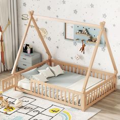 a child's bedroom with a wooden bed frame and white walls, stars on the wall