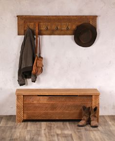 a coat rack with hats and boots hanging on it