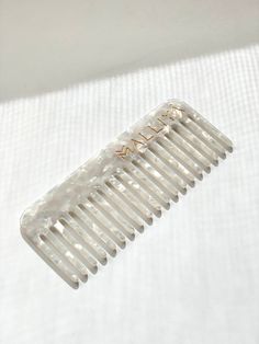 Introducing our premium LIMITED EDITION OG Comb. Beautiful enough to display in your bathroom and functional enough to slip into your purse. Perfect to use at home, out or salon use for instaworthy hair. - Environmentally friendly- Anti Static to prevent breakage- Round tip teeth- Strong, flexible and lightweight Great for your hair, great for the environment Malliya Combs are made using environmentally friendly cellulose acetate. Acetate is a plant based plastic which is 100% sustainable and known for its strength and flexibly as well as being extremely lightweight. This make it perfect for styling wet or dry. It is also hypoallergenic, which means that it is kind to sensitive skin and unlikely to cause any allergic reactions. Say goodbye to static and snagging Using the right tools for y Hair Aesthetic, Wide Tooth Comb, Cellulose Acetate, Metallic Hair, Split Ends, Product Range, White Quartz, Cosmetology, Cool Products