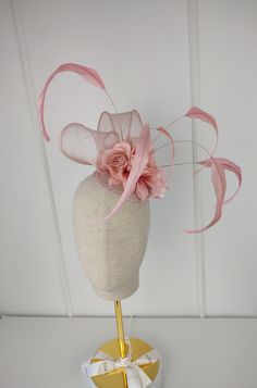 The " Pink Wildflower" is a beautiful 100% sinamay straw pink fascinator, blush pink/ light pink  fascinator hat. This light pink fascinator with flower and feather detail comes with an attached hair comb. Diameter of light pink fascinator / blush /  pink headband/  pink hair accessory = 5 inches or 12.5 cm Wear this pink fascinator/ blush pink fascinator / light pink fascinator as any special occasion hat for weddings, bridal showers, tea parties, Church, Kentucky Derby, Royal Ascot, Queen's Plate, Mother's day any race day or fashion event. This pink fascinator/ blush fascinator / light pink fascinator is bound to make a gorgeous statement. Blush Pink Fascinator, Special Occasion Hats, Pink Hair Accessories, Pink Fascinator, Bride Hat, Pink Headbands, Wedding Fascinators, Fascinator Hats, Wedding Hats