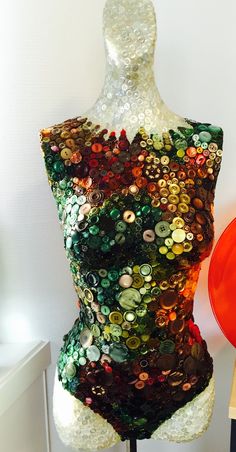 a mannequin made out of buttons on display