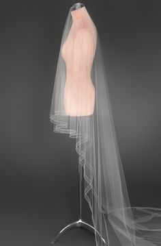 a mannequin's torso with a veil on it