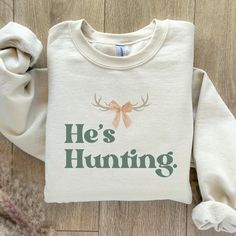 Welcome to Lucky4Gallery Co! This custom-designed cozy crewneck would make the perfect addition to your wardrobe this hunting season!  He's Hunting Sweatshirt | Wife Hunting Season Shirt | Duck Hunting | Wife Deer Hunting | Wife Abandoned | Hunting Wife Sweatshirts | Hunter Girlfriend COLORS: --sand --white  brand | Gildan 18000 Unisex Sweatshirt MATERIAL INFO:  --unisex heavy blend --crewneck - 50% cotton, 50% polyester - Medium-heavy fabric (8.0 oz/yd² (271.25 g/m - Loose fit - Sewn-in label - Runs true to size SIZES: S-4XL please refer to last photo in this listing for sizing reference!  SHIPPING + PROCESSING:  --processing: 1-3 days  --shipping: 3-5 business days  Thank you for visiting my shop! Deer Hunting Season, Hunting Season, Duck Hunting, Deer Hunting, Wife Gift, White Brand, Sew-in Labels, Heavy Fabric, Gifts For Wife