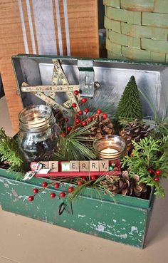 an old suitcase filled with christmas decorations and candles