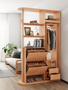 a living room with a book shelf and shoe rack on the wall next to a couch