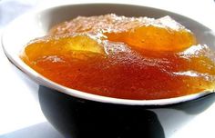 a white bowl filled with food on top of a table