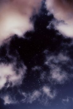 the sky is filled with clouds and stars