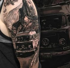 a man with a van and mountains tattoo on his arm