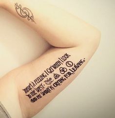 a woman's arm with some writing on it