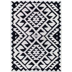 a black and white rug with an abstract design