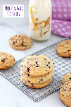 muffin mix cookies on a cooling rack next to a bottle of milk and glass of milk