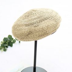 a hat is sitting on top of a stand