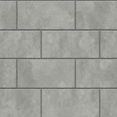 a gray brick wall with grey grouting on the bottom and white trimmings