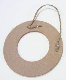 a wooden circle with rope hanging from it