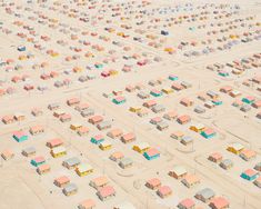 an aerial view of the beach huts and sand