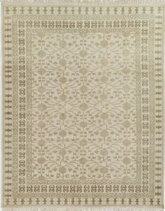 a beige rug with an intricate design on it