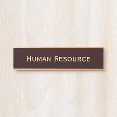 a wooden sign that says human resources on the side of a wall with wood grain