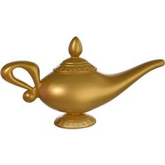 a golden teapot is sitting on a stand