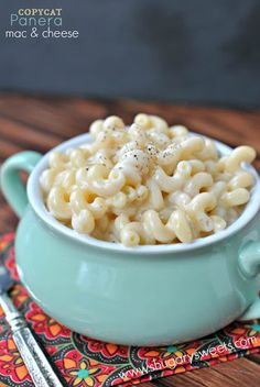 a bowl of macaroni and cheese on a place mat