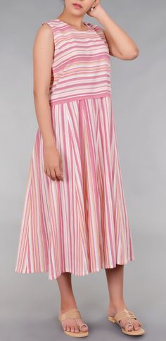 Buy Sleevless Striped Dress For Women At Rs 5650 embellished with colorful stripes on the sleeves and front, back. The kurta is adorned with classic dress material. BANDHEJ offers a varied collection of bandhani dresses, kurtas for women, cholis in silks, tissues, brocades, blouses, bandhani sarees, long skirts, designer dupattas, bandhani stoles online, etc.   #BandhaniKurtis #KurtaForWomen #BandhaniDress #BandhaniDresses #Bandhani #BandhaniDressDesigns Colour Stripes, Bandhani Sarees, Kurtas For Women, Bandhani Saree, Striped Sleeveless Dress, Long Skirts, Classic Dress