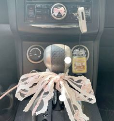 a car dashboard with an air freshener dispenser attached to it