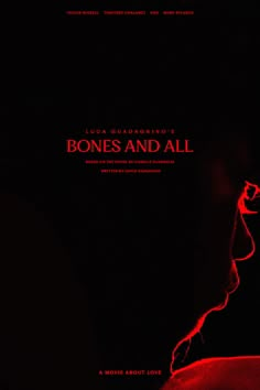 a movie poster for the film bones and all, with a man's face illuminated in red