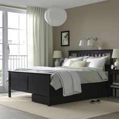 HEMNES bed frame with 2 storage boxes, black-brown/Lyngör white, King. Adjustable bed sides allow you to use mattresses of different thicknesses. Practical storage for an extra pillow, comforter or bedspread. Made of solid wood, which is a durable and warm natural material. The 4 large drawers give you an extra storage space under the bed. Leg/ Headboard/ Bedside/ Top rail/ Middle rail: Solid pine. Bedroom Black Bed Frame, Black Wood Bed Frame, Warming Blanket, Ikea Hemnes Bed, Black Beds, Hemnes Bed, Bed Frame Legs, Headboard Bedroom, Black Bed Frame