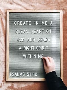 someone writing on a sign that says, create in me a clean heart or god and knew a right spirit within me