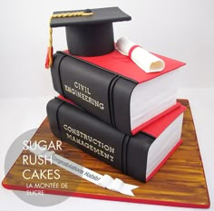 a graduation cake made to look like books