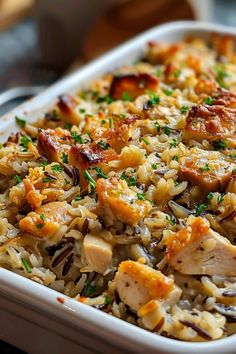 chicken and rice casserole in a white dish