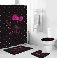 a black and pink bathroom with hello kitty shower curtain, toilet seat cover and rugs