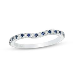 a white gold ring with blue and white diamonds