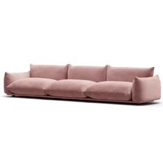 a pink couch sitting on top of a white floor