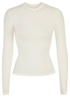 A form-fitting, ultra-flattering long sleeve tee that is perfect for everyday wear. Made of cool, comfortable stretch-cotton, this will be your new loungewear staple. Oversized Long Sleeve Shirt, Perfect White Tee, Jersey Long Sleeve, Basic Shirts, Basic Outfits, Top Fabric, Long Sleeve Crop Top, Long Sleeve Tee, Workout Shirts