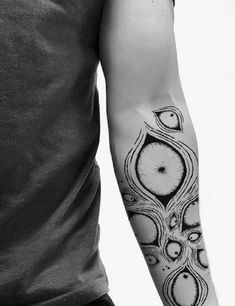 a man with a clock tattoo on his arm