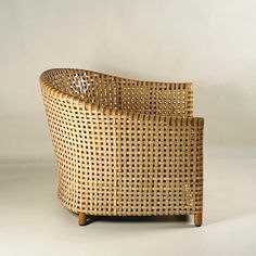 a wicker chair sitting on top of a white floor