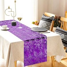 a purple table runner on a dining room table