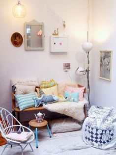 a living room filled with lots of furniture and decor