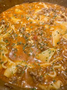 a large pot filled with pasta and meat