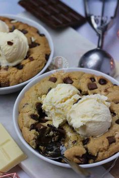 two bowls filled with ice cream and chocolate chip cookies