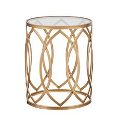 a gold metal and glass side table with circles on the top, against a white background