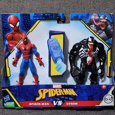 two spider - man action figures in their packaging