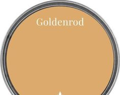 the goldenrod logo is shown on an orange circle with white lettering and a silver rim