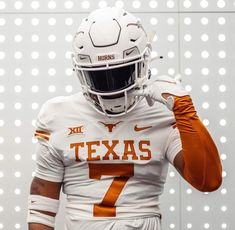 the texas football uniform is white and orange