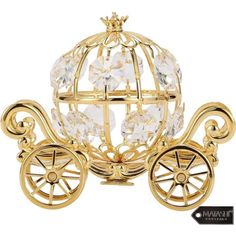 a golden carriage with crystal balls and wheels