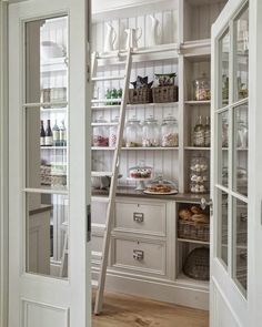 an open door leading to a pantry filled with food